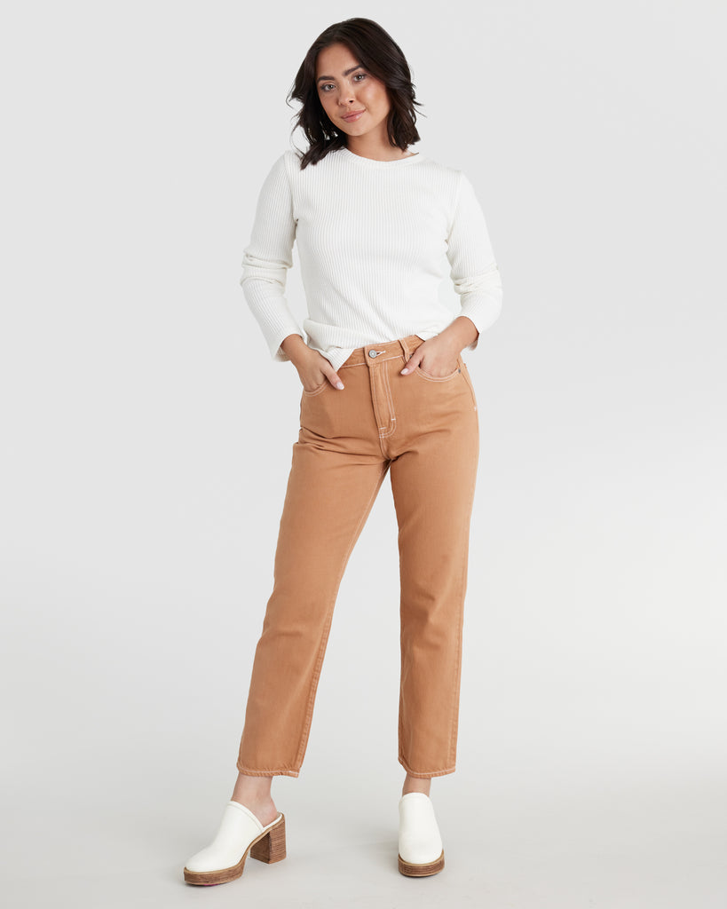 Woman in orange ankle length jeans