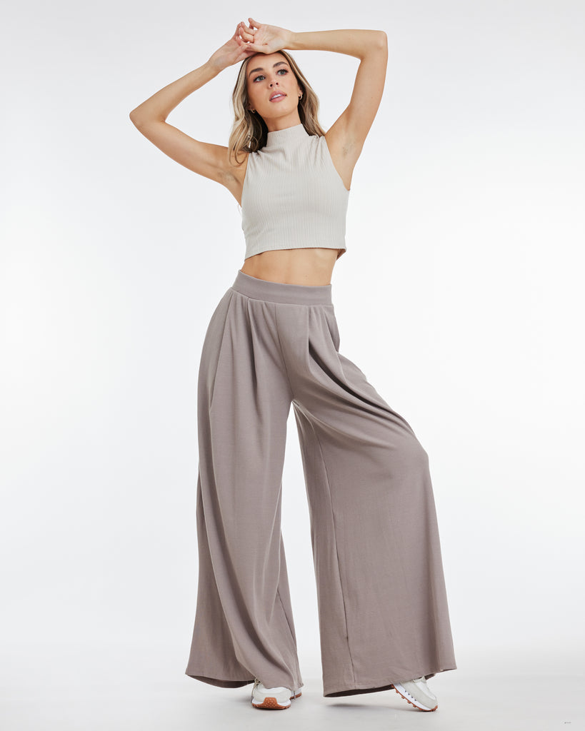 Woman in taupe, wide leg stretchy pants