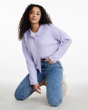 Woman in a lavender long sleeve cardigan