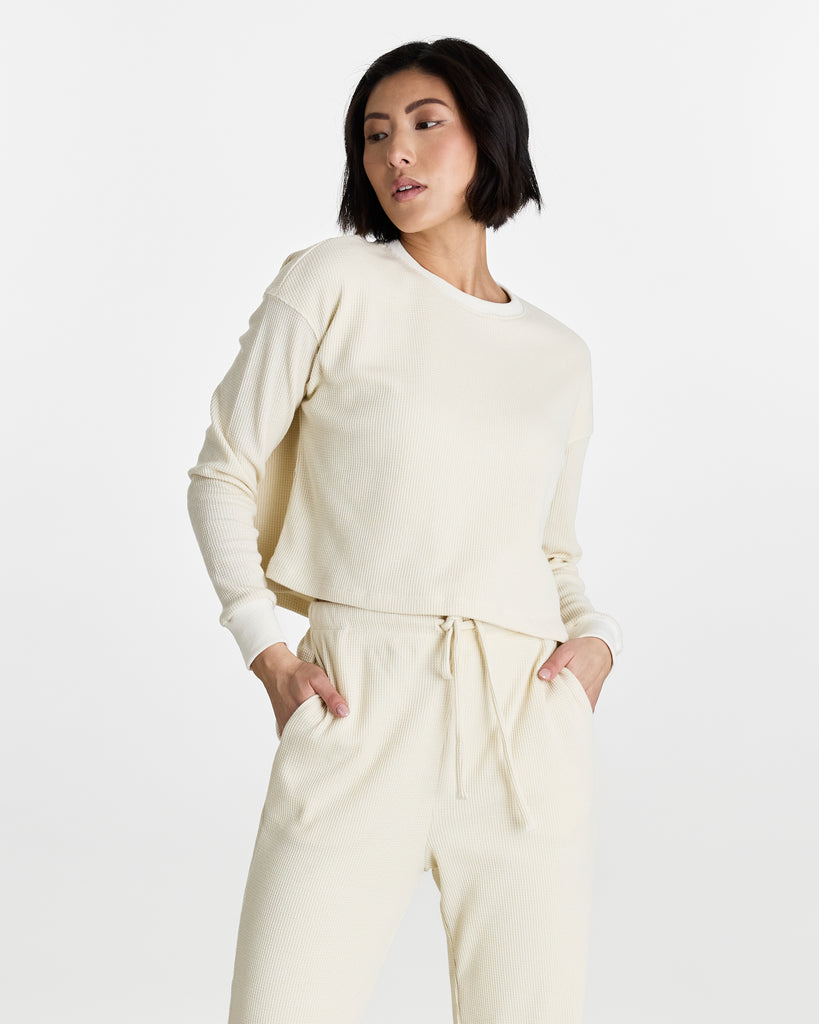 Woman in a long sleeve, boxy fit, top