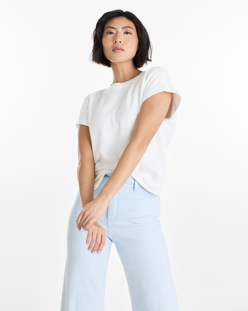 Woman in a white, short sleeve, basic tee